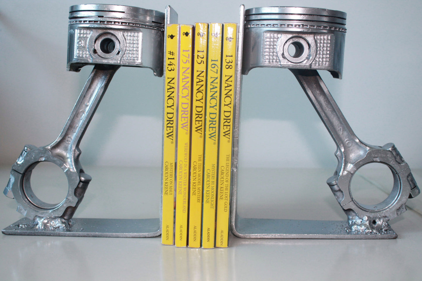 Piston book holder