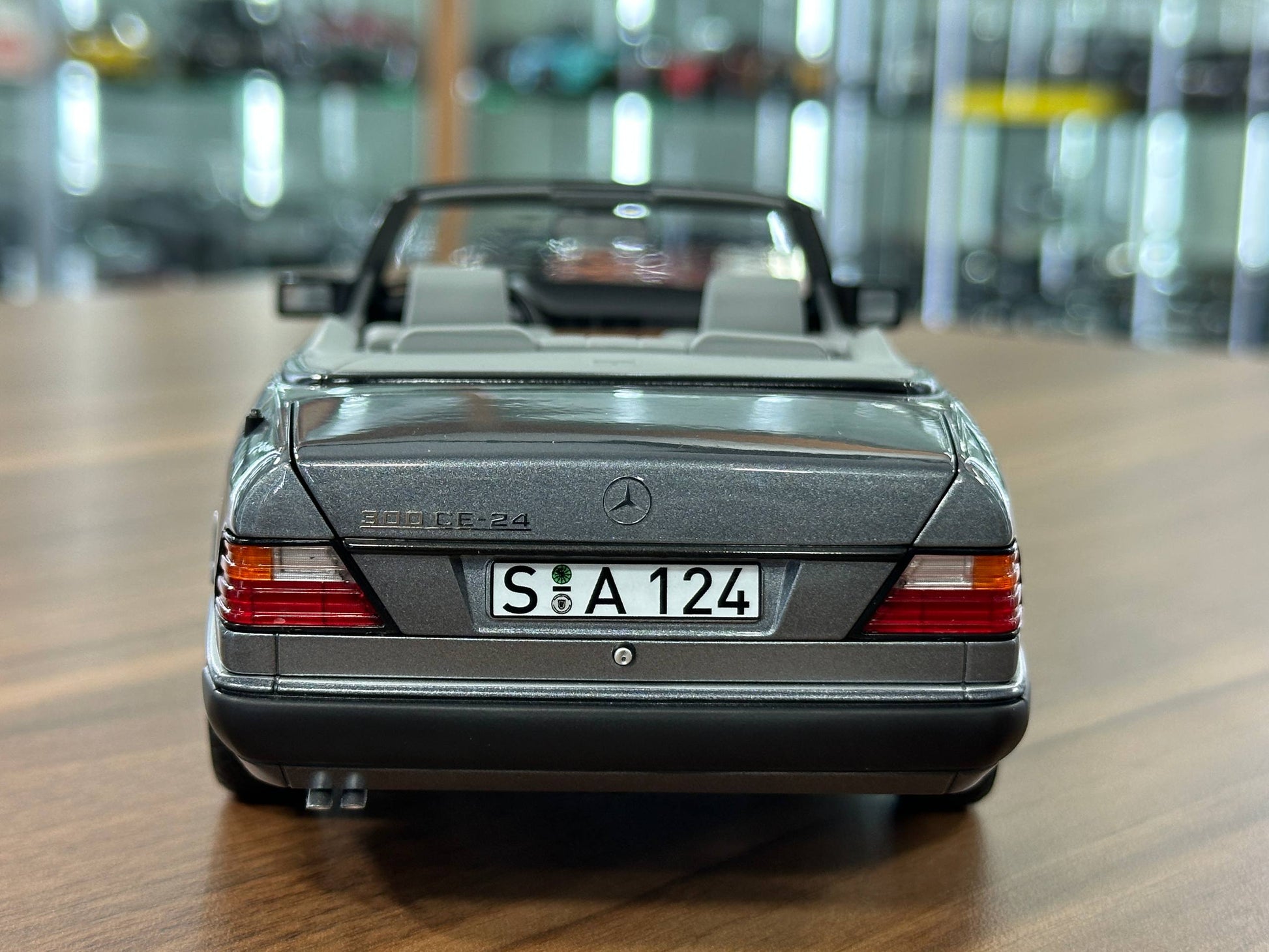 1/18 Diecast Mercedes-Benz 300 CE-24 Cabriolet (W124, 1991–1993) – Norev Dealer Edition (Pearl Grey)