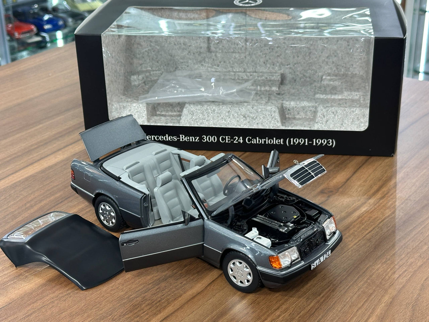 1/18 Diecast Mercedes-Benz 300 CE-24 Cabriolet (W124, 1991–1993) – Norev Dealer Edition (Pearl Grey)
