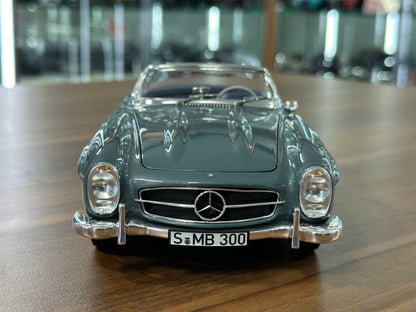 1/18 Diecast Mercedes-Benz 300 SL Roadster (W198, 1957–1963) – Norev Dealer Edition (Light Blue, Full Opening)