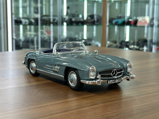 1/18 Diecast Mercedes-Benz 300 SL Roadster (W198, 1957–1963) – Norev Dealer Edition (Light Blue, Full Opening)
