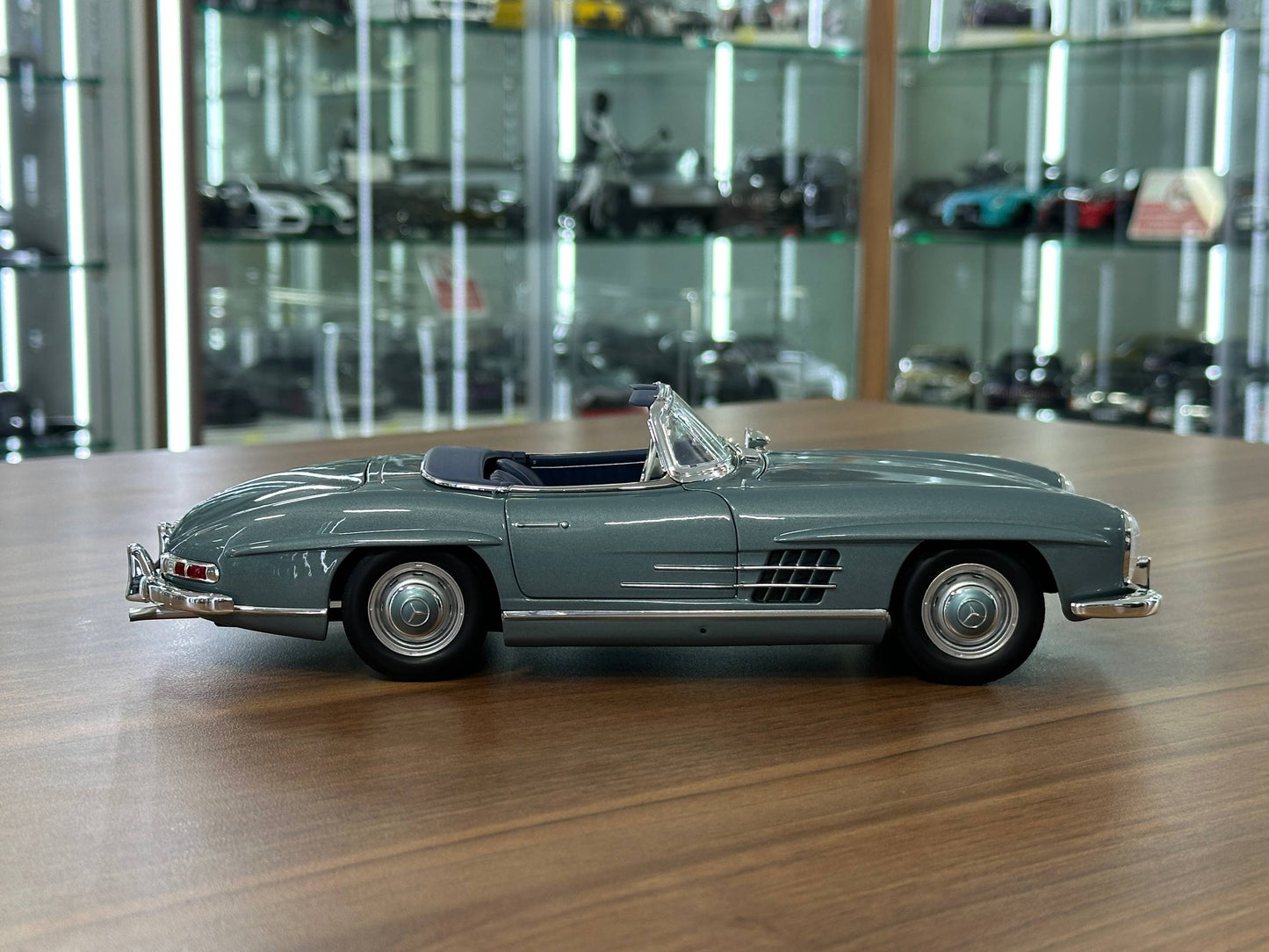 1/18 Diecast Mercedes-Benz 300 SL Roadster (W198, 1957–1963) – Norev Dealer Edition (Light Blue, Full Opening)