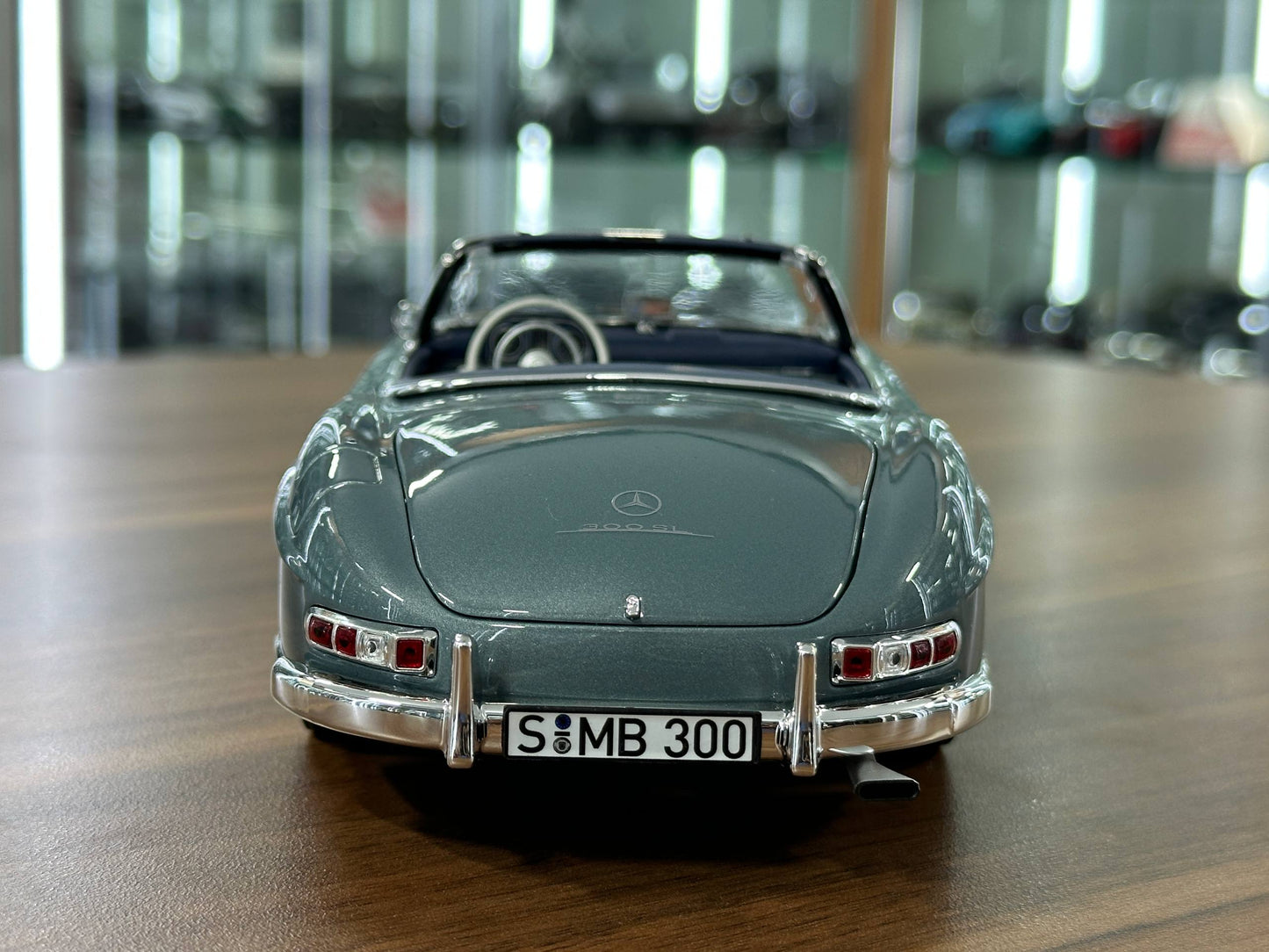 1/18 Diecast Mercedes-Benz 300 SL Roadster (W198, 1957–1963) – Norev Dealer Edition (Light Blue, Full Opening)