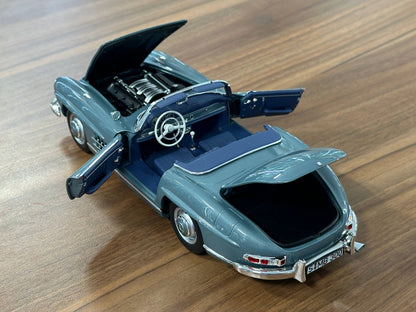 1/18 Diecast Mercedes-Benz 300 SL Roadster (W198, 1957–1963) – Norev Dealer Edition (Light Blue, Full Opening)