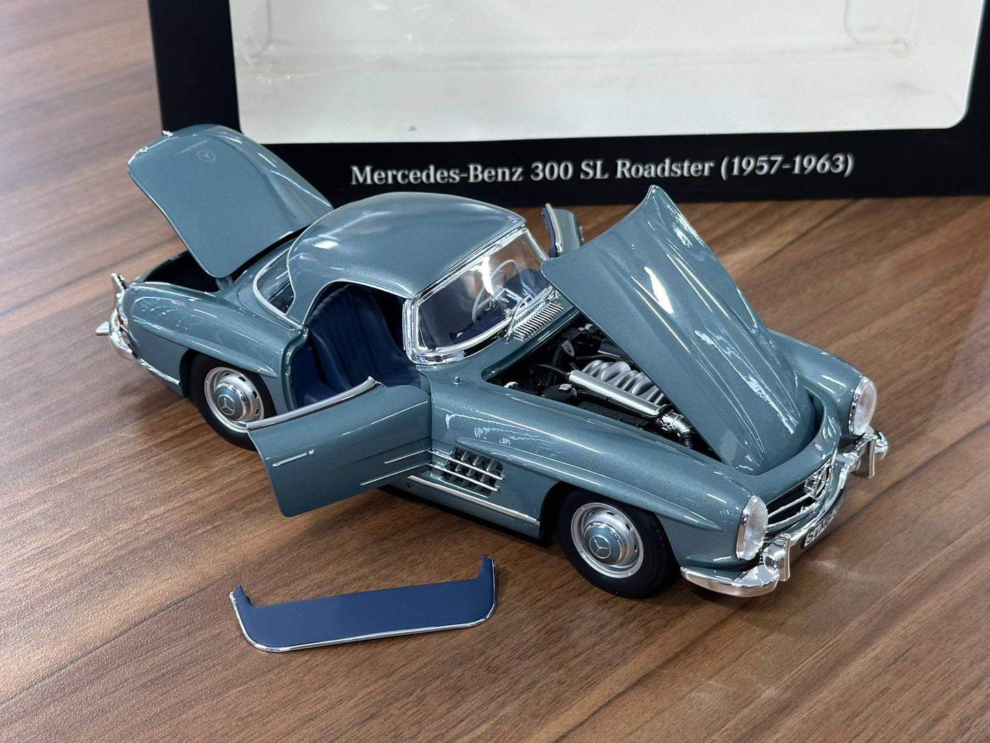1/18 Diecast Mercedes-Benz 300 SL Roadster (W198, 1957–1963) – Norev Dealer Edition (Light Blue, Full Opening)