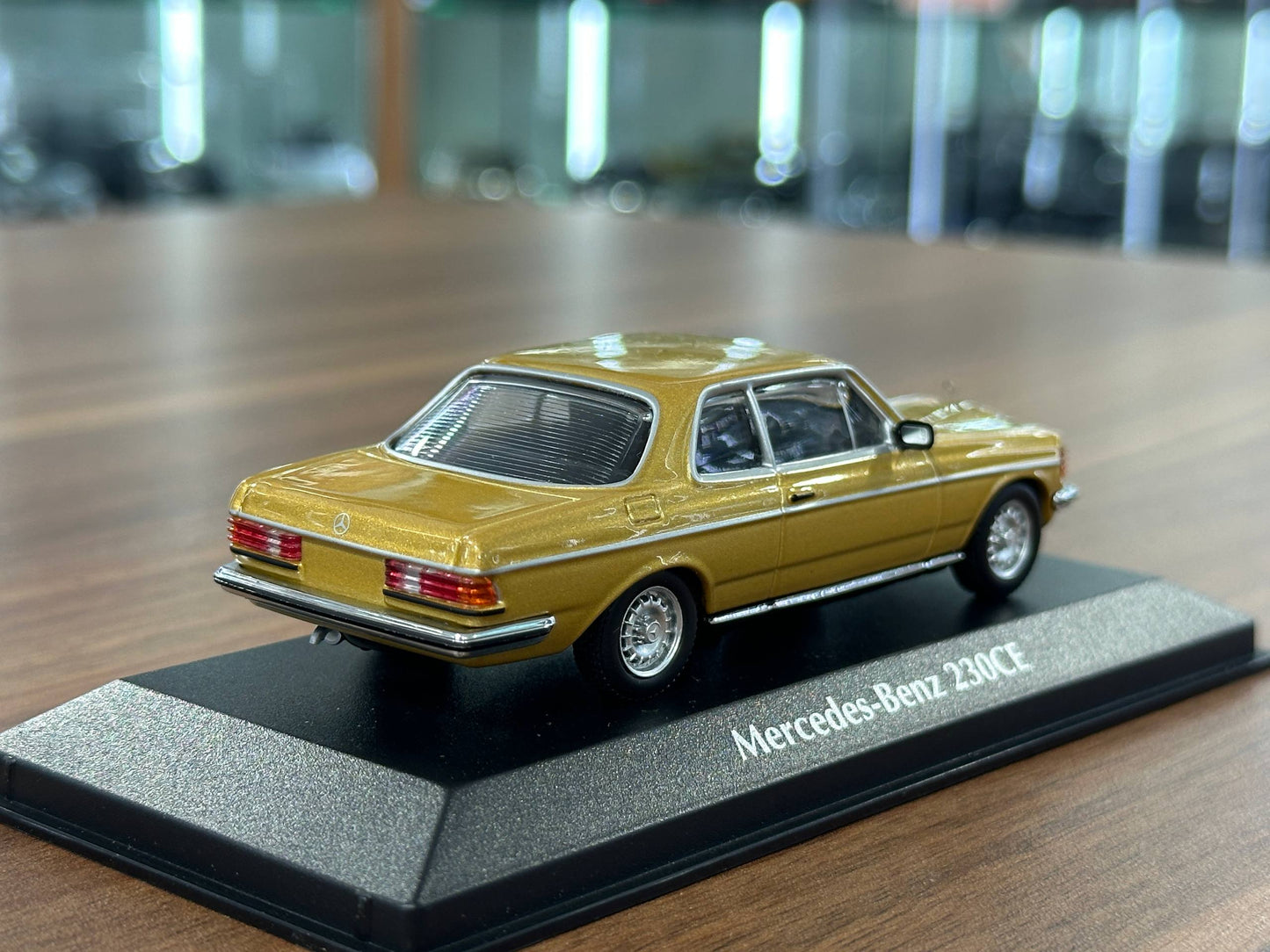 1/43 Diecast Mercedes Benz 230 CE 1976 in Gold Metallic (Maxichamps)