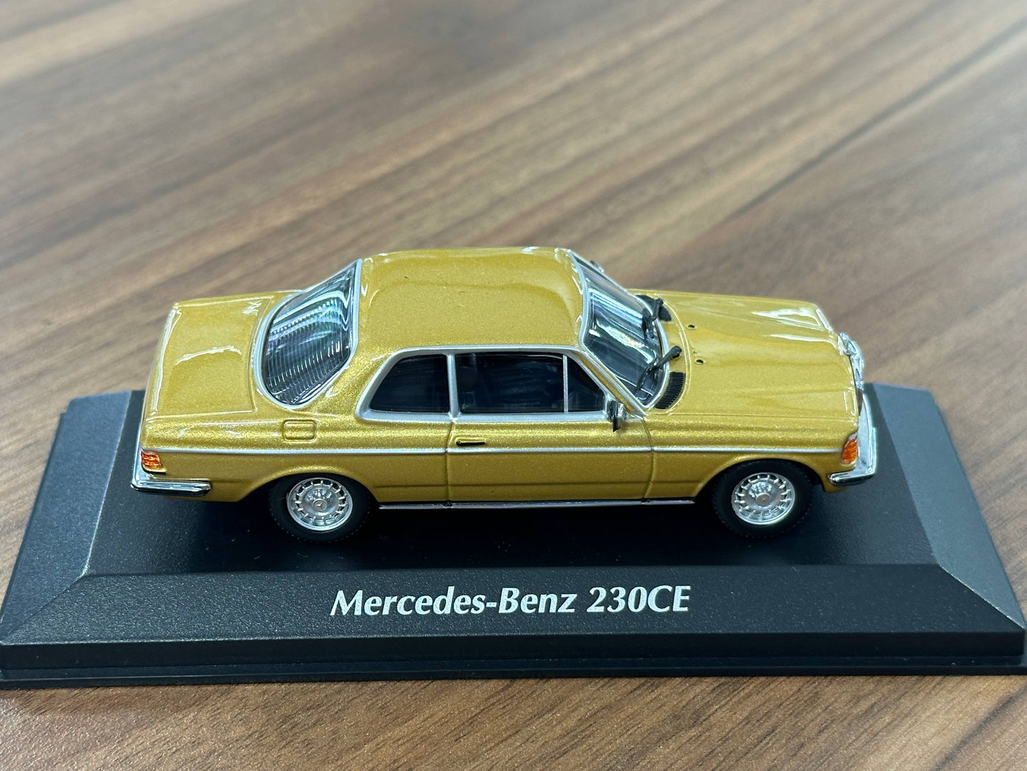 1/43 Diecast Mercedes Benz 230 CE 1976 in Gold Metallic (Maxichamps)