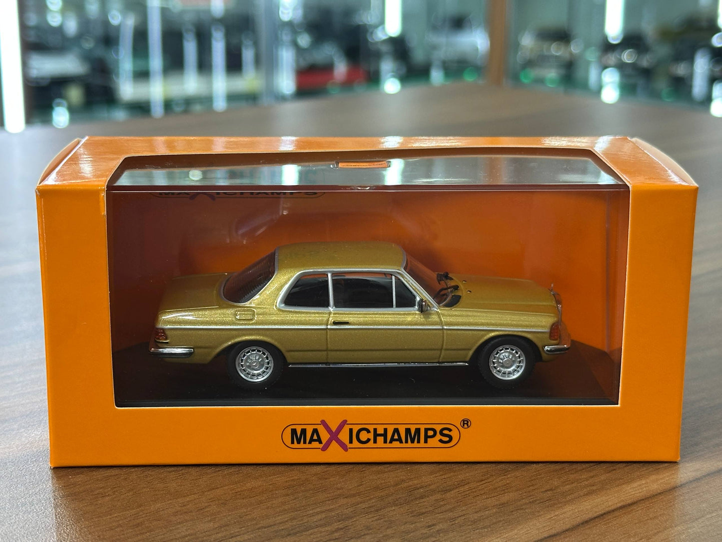 1/43 Diecast Mercedes Benz 230 CE 1976 in Gold Metallic (Maxichamps)