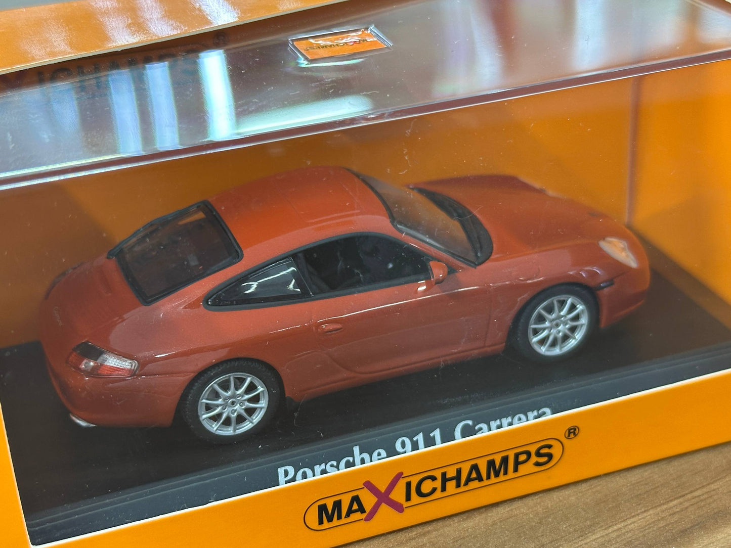 1/43 Diecast Maxichamps Porsche 911 Carrera 2001 in Orange Red Metallic