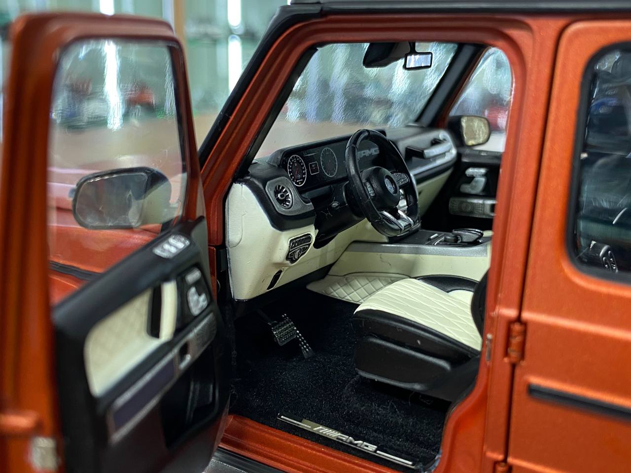 1/18 Diecast  – Mercedes-Benz G 63 AMG Model | Minichamps Dealer Edition | Full Opening | Copper Orange Magno